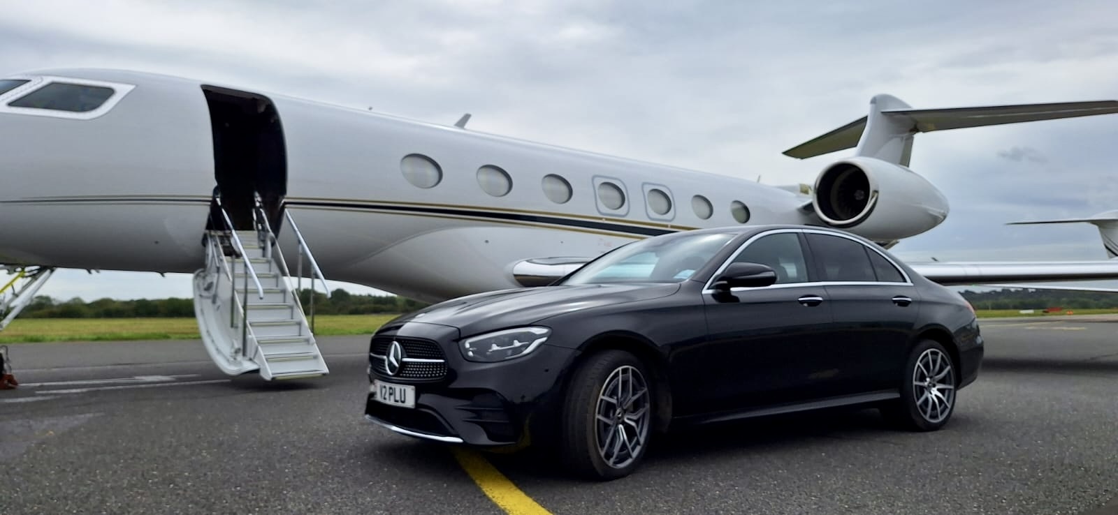 When Your Passenger Is the Pilot: A Private-Jet Ramp Moment with Our Mercedes E-Class